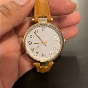 Beige and gold watch